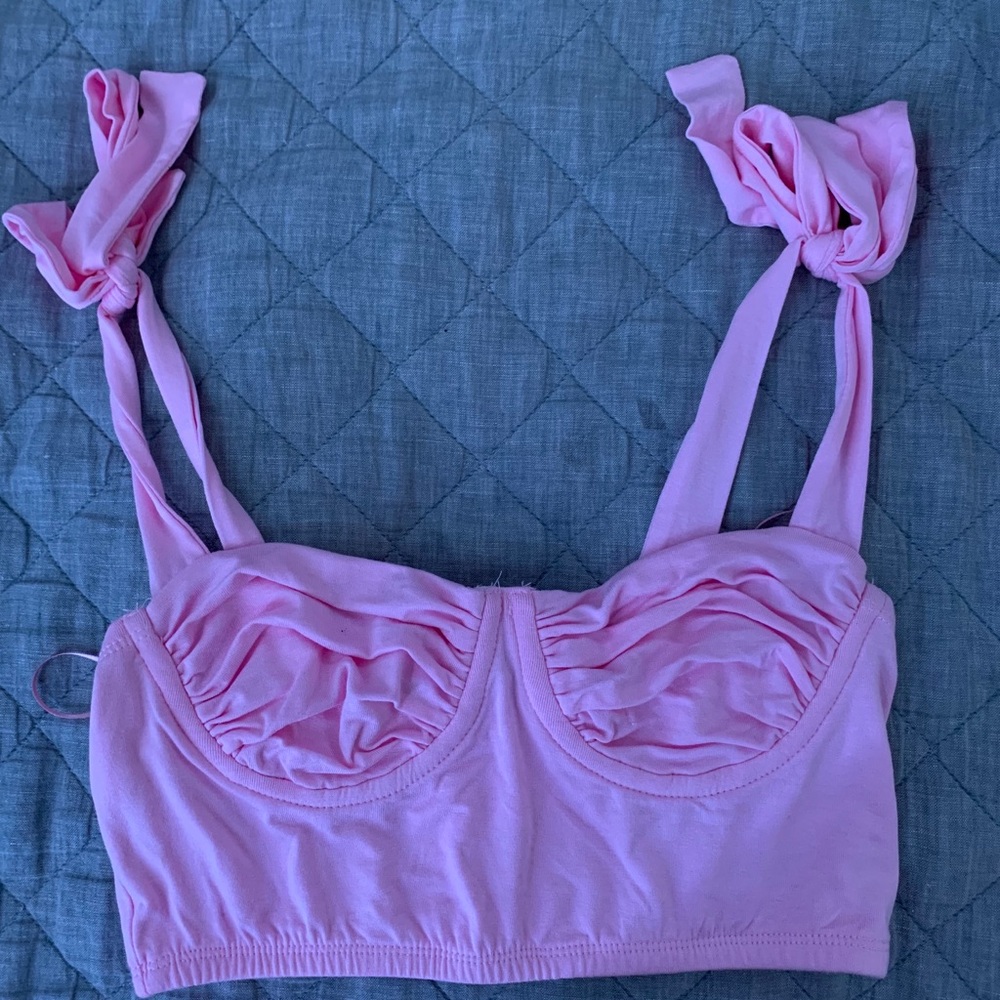 a pink top